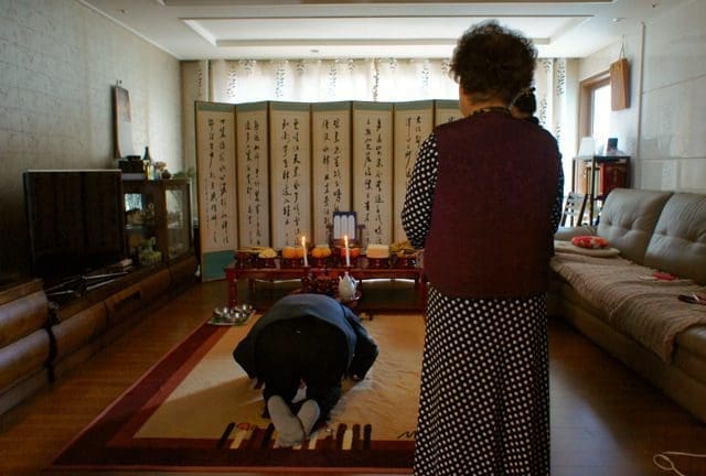 an ajumma performing a jesa ceremony