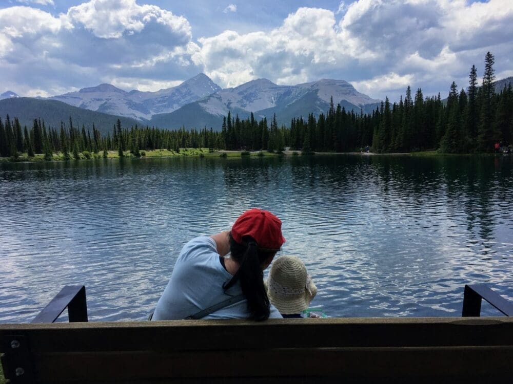 The Unforgettable, Forget-Me-Not Pond in Kananaskis 1 Mom and daughter looking at forget me not pond in kananaski alberta